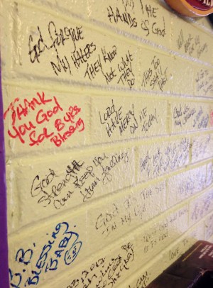 Lola says she is on a divine mission and hand writes holy scripture on the wall of her restaurant to help her push through when she is tired and remind her of her obligation to give back.