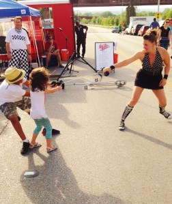 Mama Lou, American Strong Woman tests the strength of her chain with the help of two young volunteers. Lindsey Lindberg is a member of the Austin Buskers Project, a group whose goal is to promoter street performance art in the city. Lindberg calls busking,